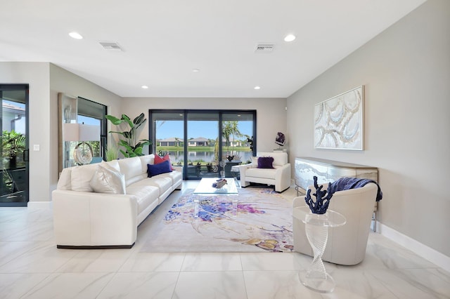 living room featuring a water view