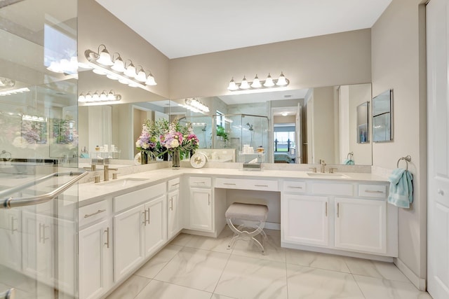 bathroom featuring vanity and a shower with door