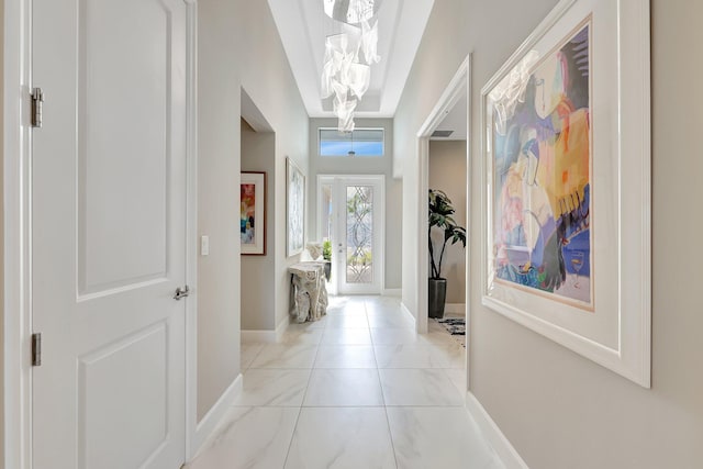 corridor featuring vaulted ceiling