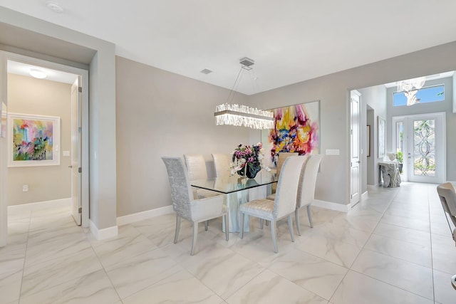 dining area featuring a chandelier