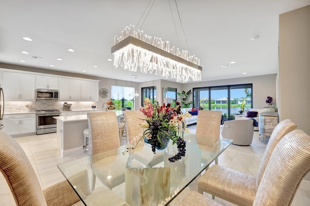 dining area with light tile patterned floors