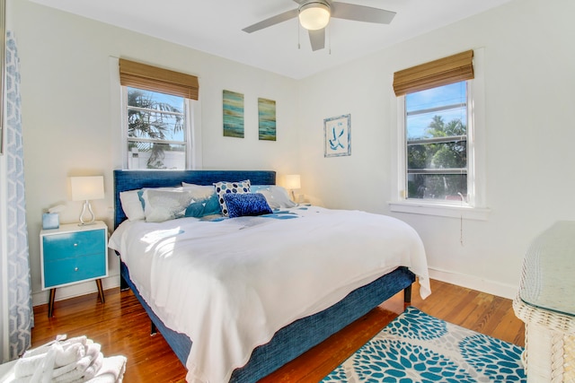 bedroom featuring ceiling fan and hardwood / wood-style flooring