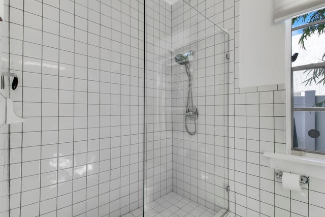 bathroom with a tile shower