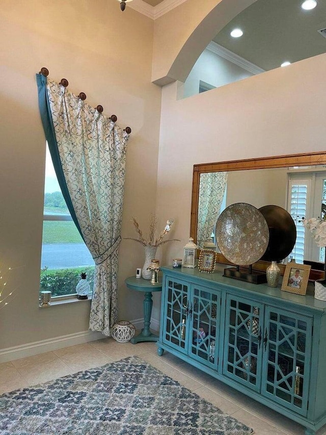 interior space featuring crown molding and tile patterned flooring