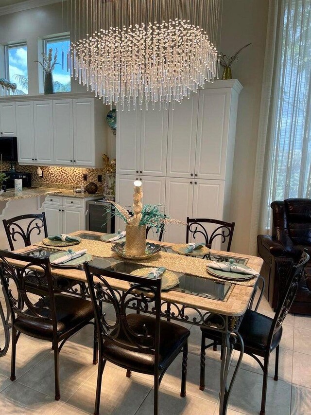 dining space with an inviting chandelier and light tile patterned floors