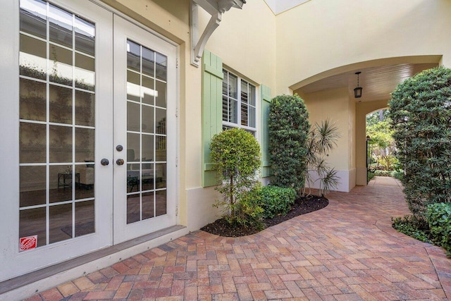 doorway to property with french doors and stucco siding