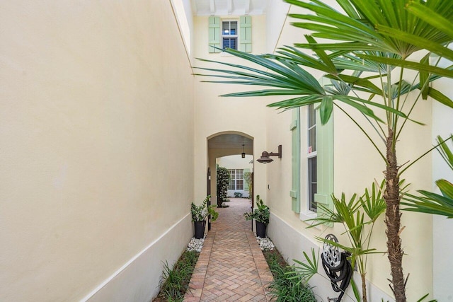 property entrance with stucco siding