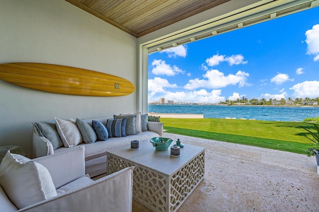 view of patio featuring a water view and outdoor lounge area