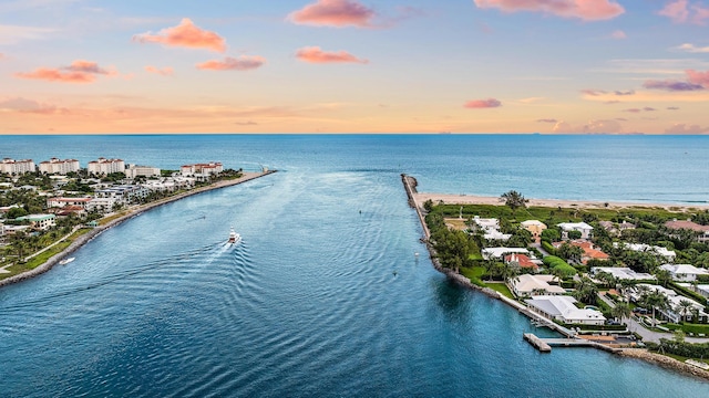 aerial view at dusk with a water view