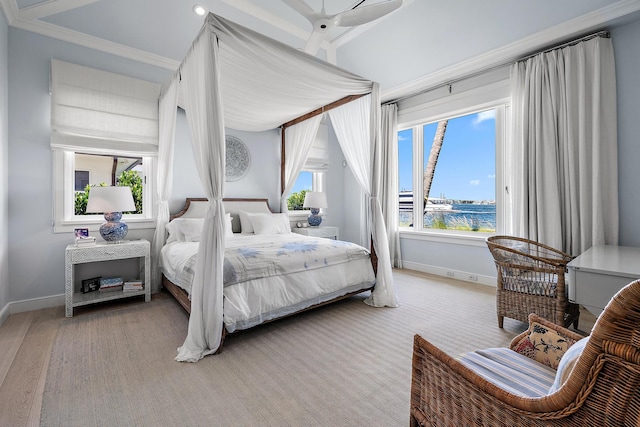 bedroom featuring ceiling fan, ornamental molding, light hardwood / wood-style floors, and a water view