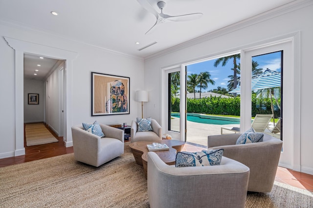 tiled living room with ceiling fan and crown molding