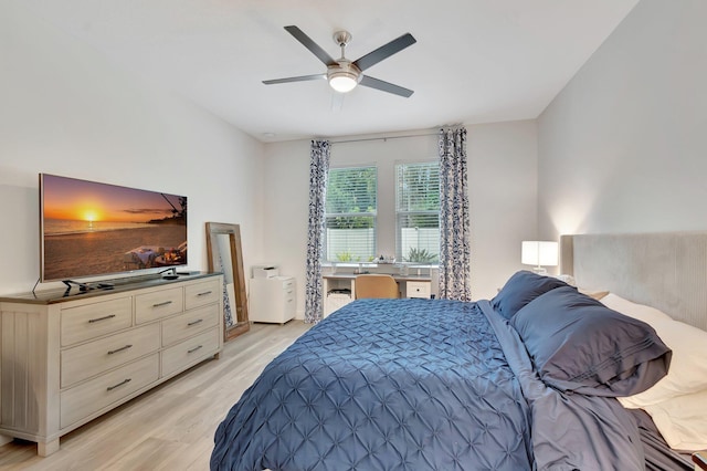 bedroom with light wood-style floors and ceiling fan