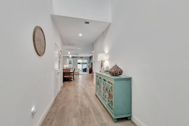 corridor with recessed lighting, baseboards, visible vents, and light wood-type flooring