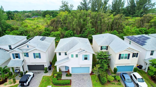 bird's eye view with a residential view and a view of trees
