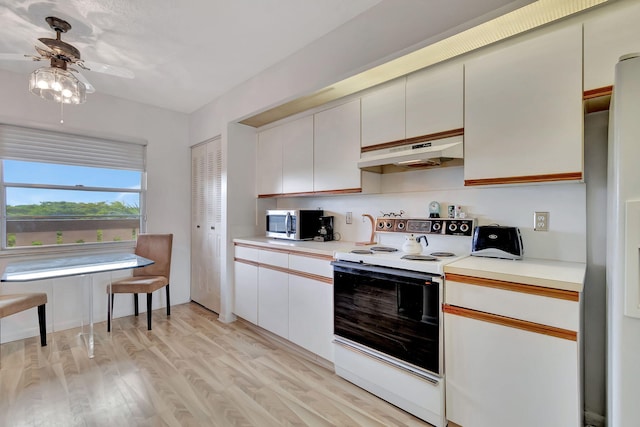 kitchen featuring white cabinets, ceiling fan, light wood-type flooring, and stainless steel appliances