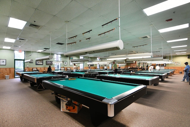 game room with carpet flooring, a paneled ceiling, wood walls, and billiards