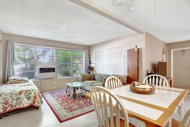 dining area with cooling unit and plenty of natural light