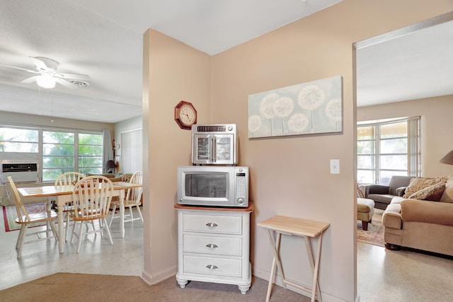 kitchen with ceiling fan and plenty of natural light