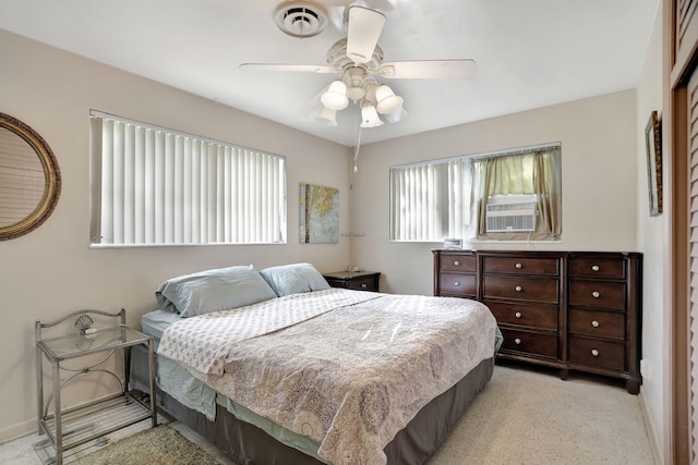 bedroom with ceiling fan and cooling unit