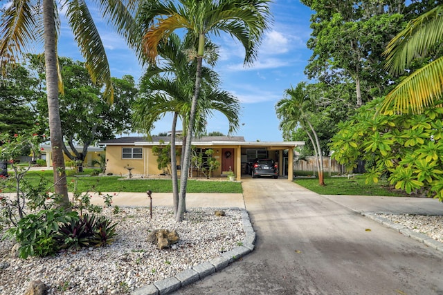 single story home featuring a carport