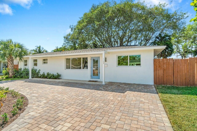 ranch-style home with a patio