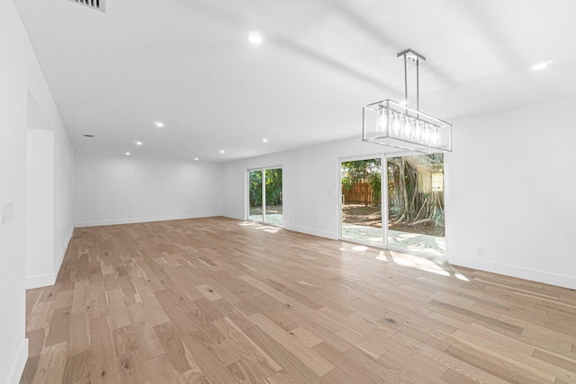 unfurnished living room featuring light hardwood / wood-style floors