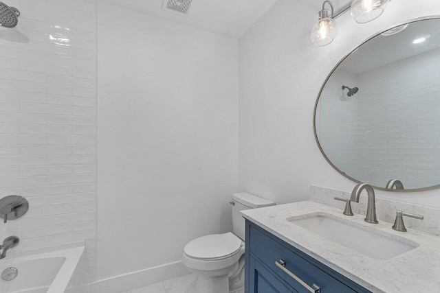 full bathroom with vanity, toilet, and tiled shower / bath