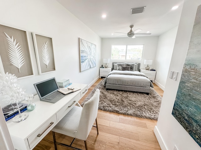 bedroom with ceiling fan and light hardwood / wood-style floors