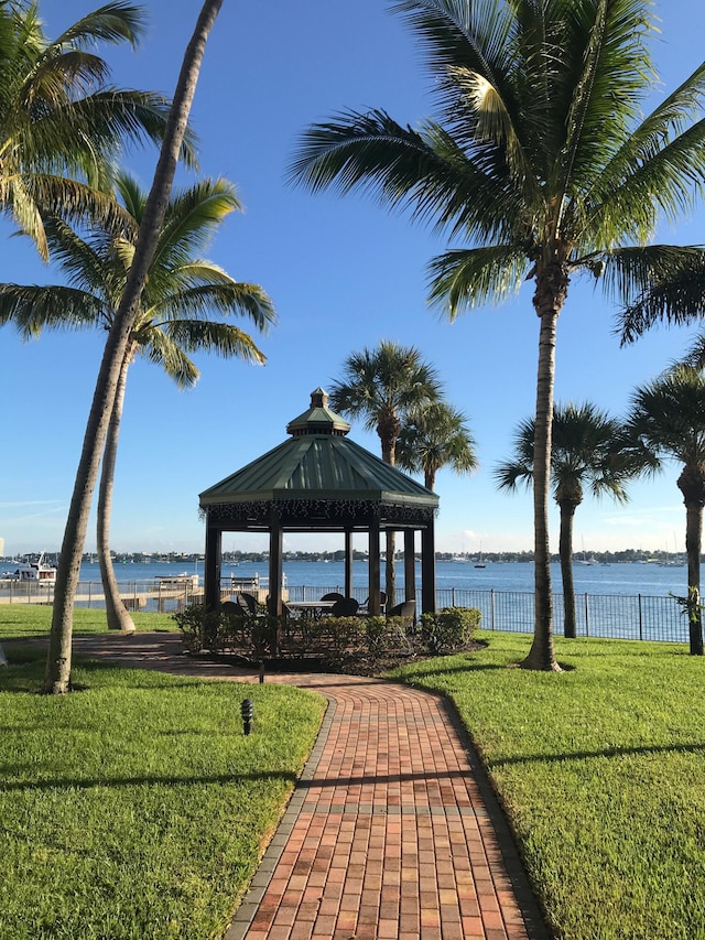 view of home's community featuring a gazebo, a yard, and a water view