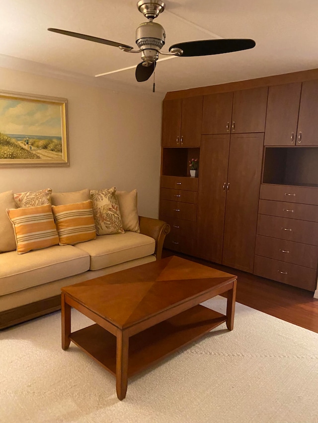 living room featuring dark hardwood / wood-style floors and ceiling fan