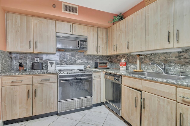 kitchen with tasteful backsplash, black appliances, sink, and light brown cabinetry