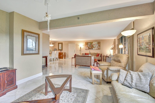 living room featuring beamed ceiling