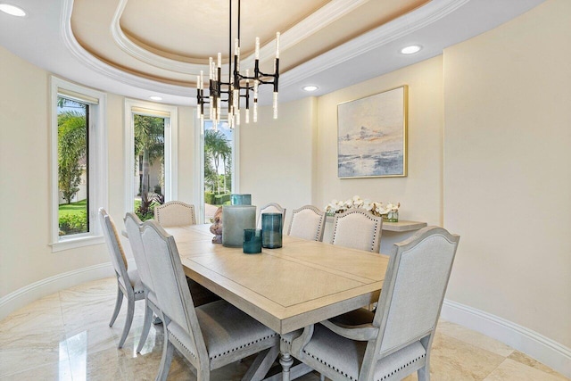 dining room featuring a tray ceiling and an inviting chandelier