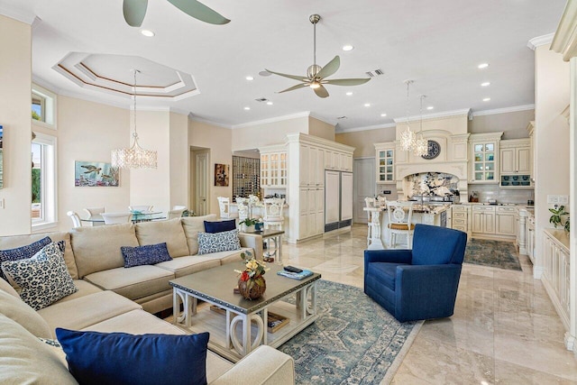 living room with crown molding and ceiling fan with notable chandelier