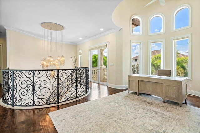 bedroom with ornamental molding, dark wood-type flooring, multiple windows, and access to outside