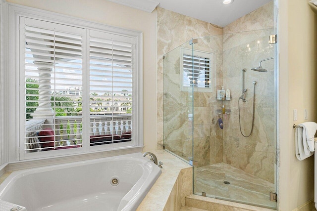 bathroom with separate shower and tub