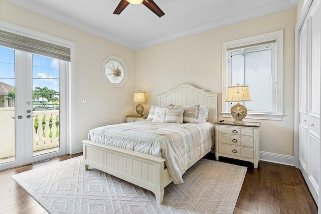 bedroom with a closet, ceiling fan, dark wood-type flooring, and access to exterior