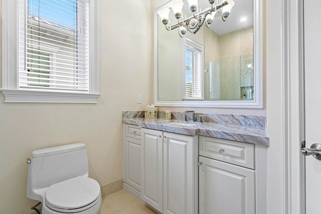 bathroom with vanity, toilet, and tile patterned floors