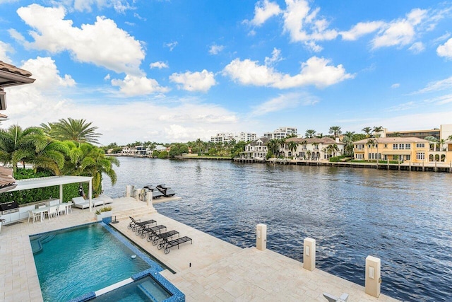 exterior space with a water view and a patio area