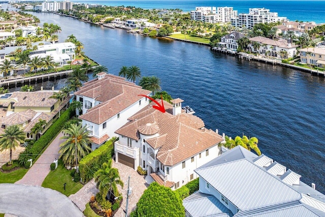 birds eye view of property featuring a water view