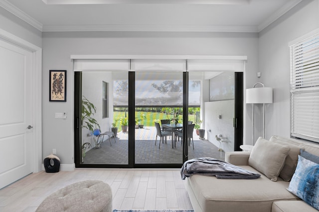 bedroom with access to exterior, crown molding, and light hardwood / wood-style floors