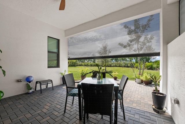 view of patio featuring ceiling fan