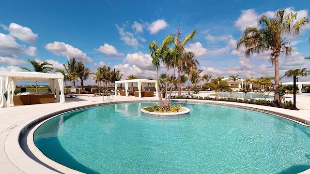 view of pool featuring a gazebo and a patio