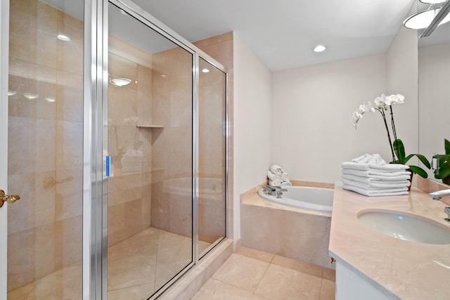 bathroom with separate shower and tub, tile patterned floors, and vanity