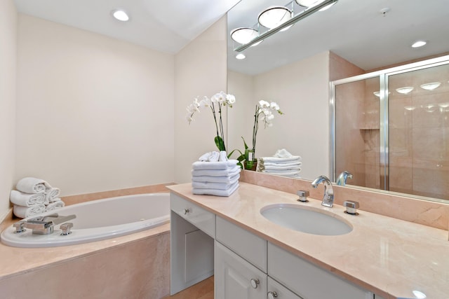 570 Ocean Dr Unit 1302, Juno Beach, FL 33408 - full bathroom with a stall shower, vanity, a bath, and recessed lighting