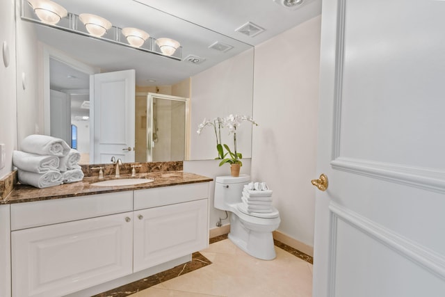 570 Ocean Dr Unit 1302, Juno Beach, FL 33408 - bathroom featuring a stall shower, toilet, tile patterned flooring, and vanity