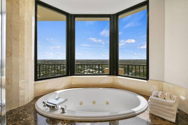 bathroom featuring tiled bath