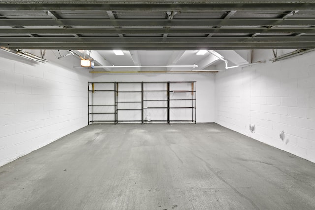 570 Ocean Dr Unit 1302, Juno Beach, FL 33408 - garage featuring a garage door opener and concrete block wall