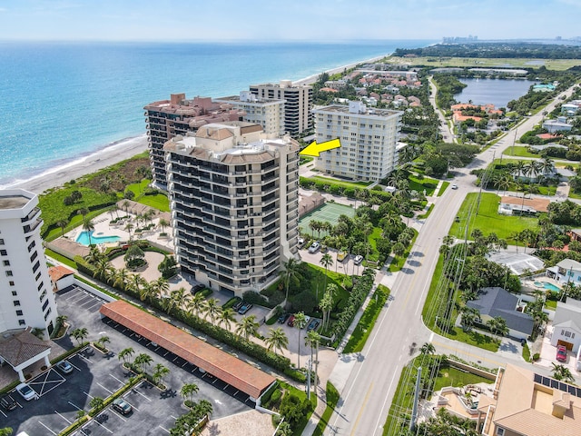 aerial view featuring a water view and a beach view