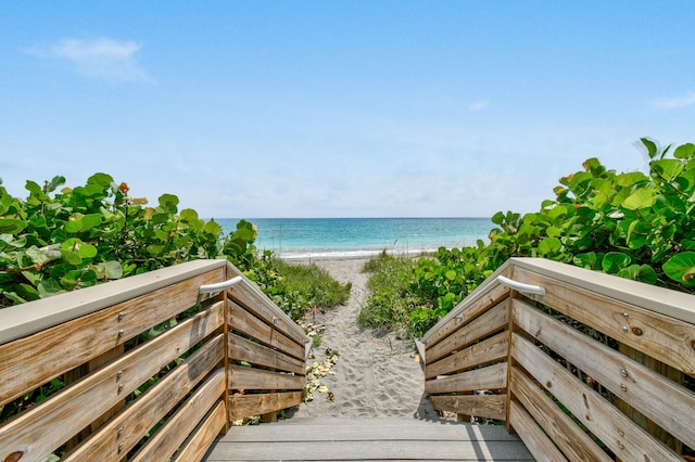 property view of water featuring a beach view